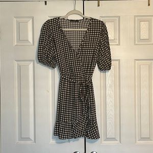 Black and White plaid tea dress with frill on hem. Size 6.
